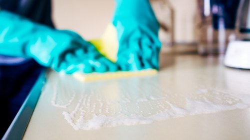 Local rug cleaner working on a wool rug in a Hounslow property